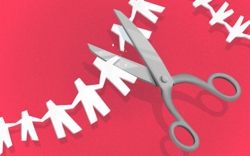 Tech layoffs: Illustration of scissors cutting a paper people chain.