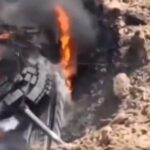 A Russian tank stuck in a large crater became a sitting duck for Ukraine's drones, a video appears to show