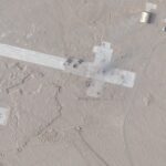 Satellite images show apparent mock-ups of US fifth-gen fighter jets and a runway with blast marks and craters in a Chinese desert