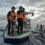 Video shows Chinese coast guard brandishing an ax in a low-tech clash with the Philippines navy