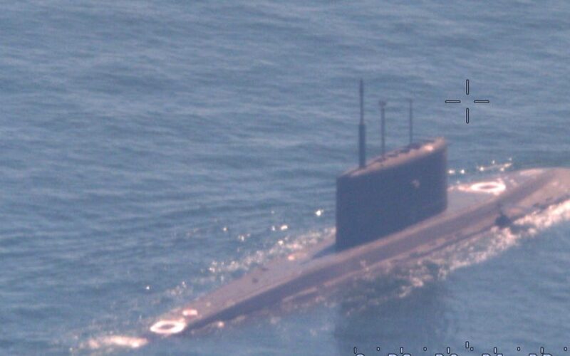 A NATO sub hunter captured these shots of a Russian submarine in waters newly surrounded by the alliance