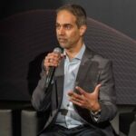 Arjun Dugal, executive vice president, divisional CIO, Card Technology, Capital One shares his insights on how to succeed with AI adoption at scale with the  VB Transform audience. Credit: Louis Columbus/VentureBeat