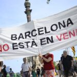 Protesters spray water guns at tourists in Barcelona as thousands rally against overtourism