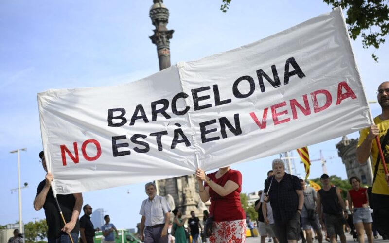 Protesters spray water guns at tourists in Barcelona as thousands rally against overtourism