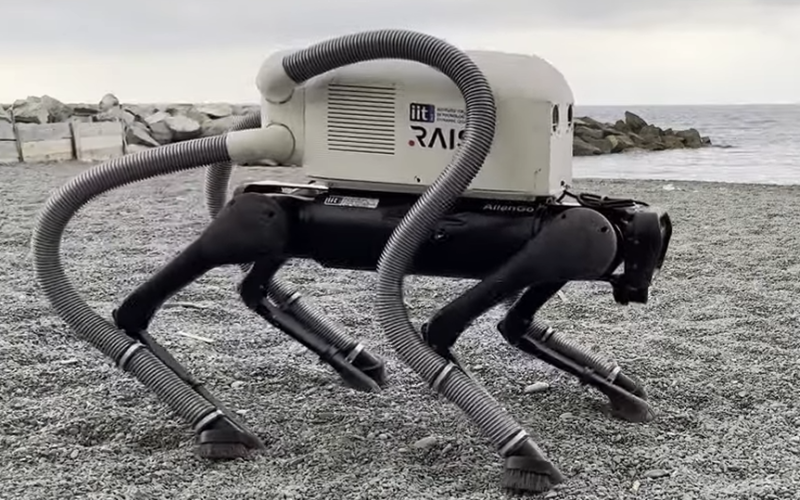 This vacuum robot dog can find and suck up trash with its feet