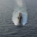 An unusual announcement about a US Navy submarine packed with cruise missiles is a loud message that puts Iran on notice