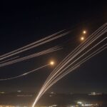 Video shows Israel's Iron Dome missile defense system intercepting Hezbollah rockets overnight as fears over wider conflict mount