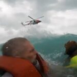 Dramatic video shows US Coast Guard rescue a man and his dog after their boat started sinking during Hurricane Helene