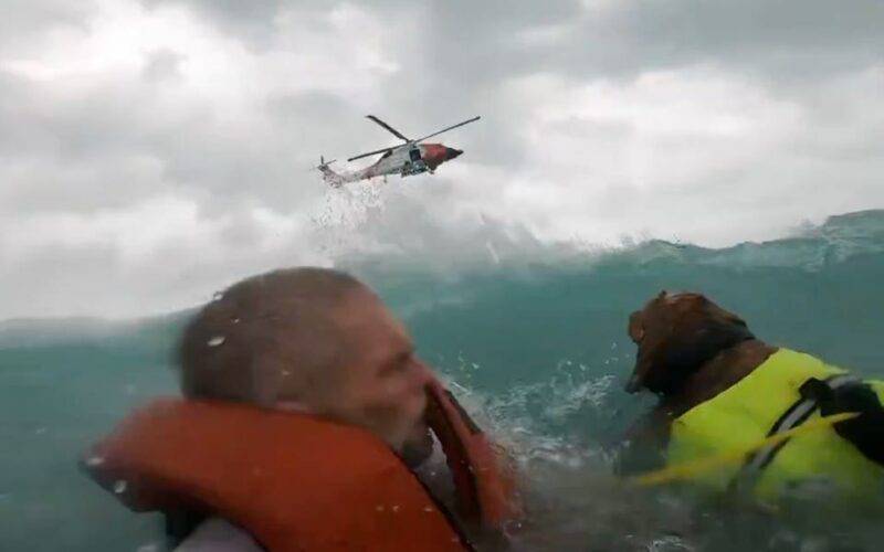 Dramatic video shows US Coast Guard rescue a man and his dog after their boat started sinking during Hurricane Helene