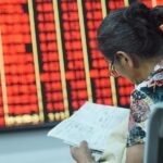 China's stock markets reopen tomorrow after a weeklong break. Investors — and social media — are buzzing.