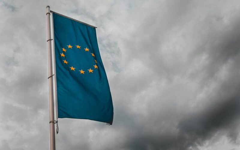 Flag of the European Union illustrating the looming EU AI Act, a framework that places stringent regulations on how businesses can integrate artificial intelligence.