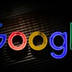 Google logo neon sign as the company announces a restructuring of its divisions and leadership to accelerate its AI initiatives.