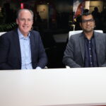 Vivek Valecha, associate vice president of intelligent automation at Persistent Systems, and Derek Downs, head of channels and alliances at OutSystems – UiPath FORWARD 2024