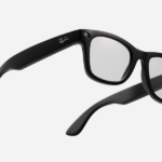 Black frames smart glasses with clear lenses.