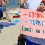 Tourism in Spain is booming, despite protests that included spraying visitors with water guns