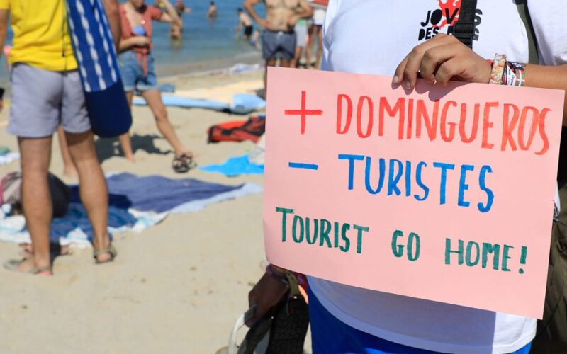 Tourism in Spain is booming, despite protests that included spraying visitors with water guns