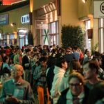 Photos show Black Friday crowds at retailers across the US even as more shoppers move online