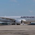 An Air France passenger says he was injured when his business-class seat came loose during takeoff, and is suing the airline