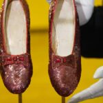 Ruby slippers worn by Judy Garland in 'The Wizard of Oz' sell for a record $28 million at auction